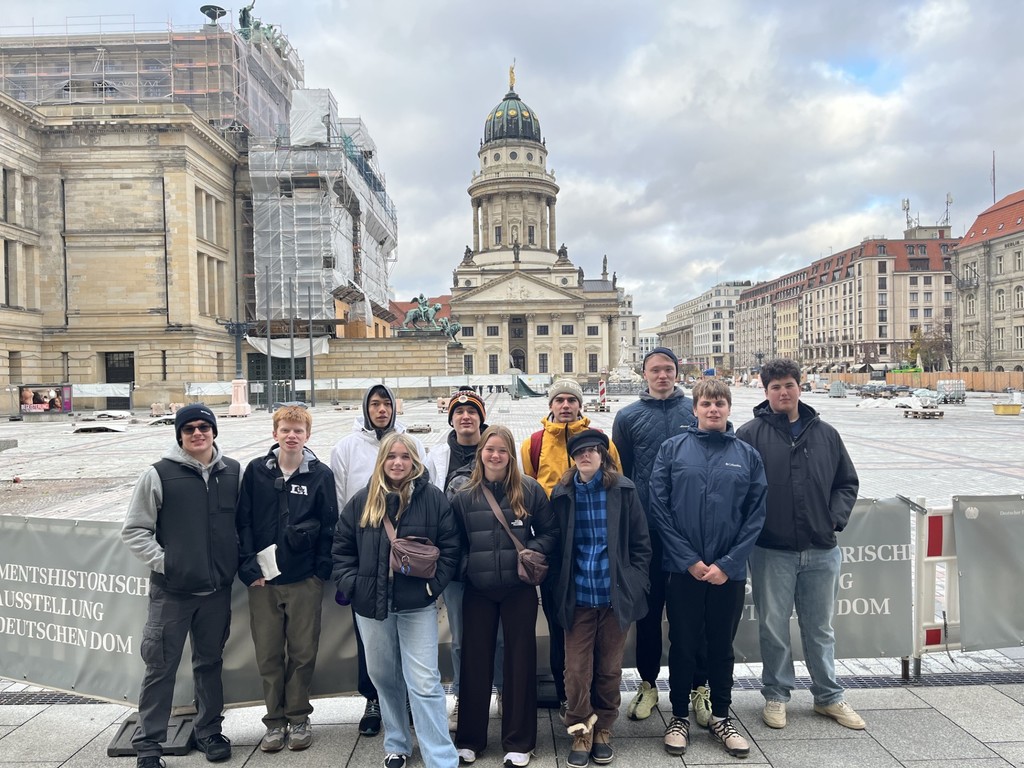 group of students in front of a domed building in Germany