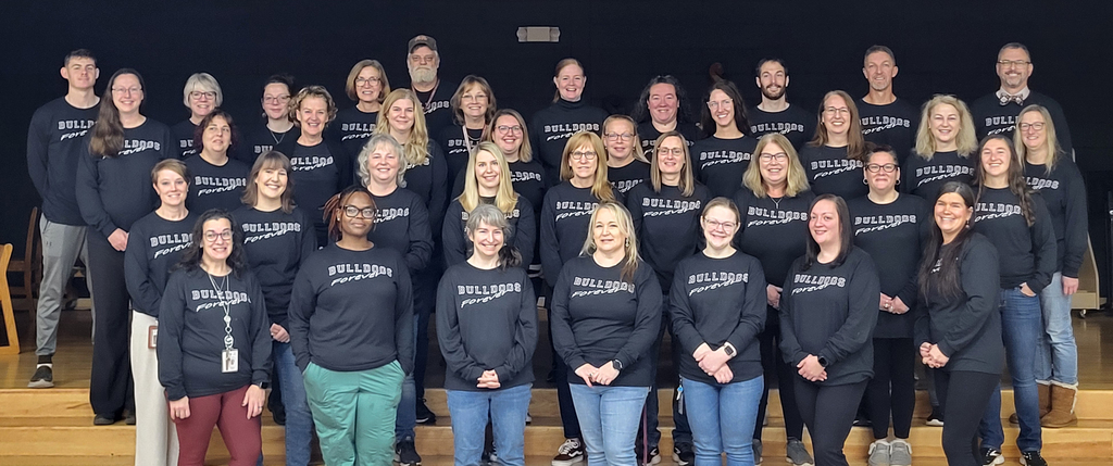 group photo of elementary teachers and staff wearing Bulldogs Forever t-shirts