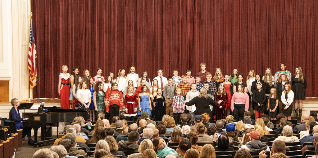 adult conducting middle school chorus
