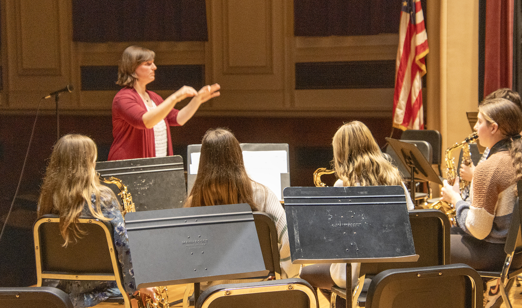 adult conducting middle school band
