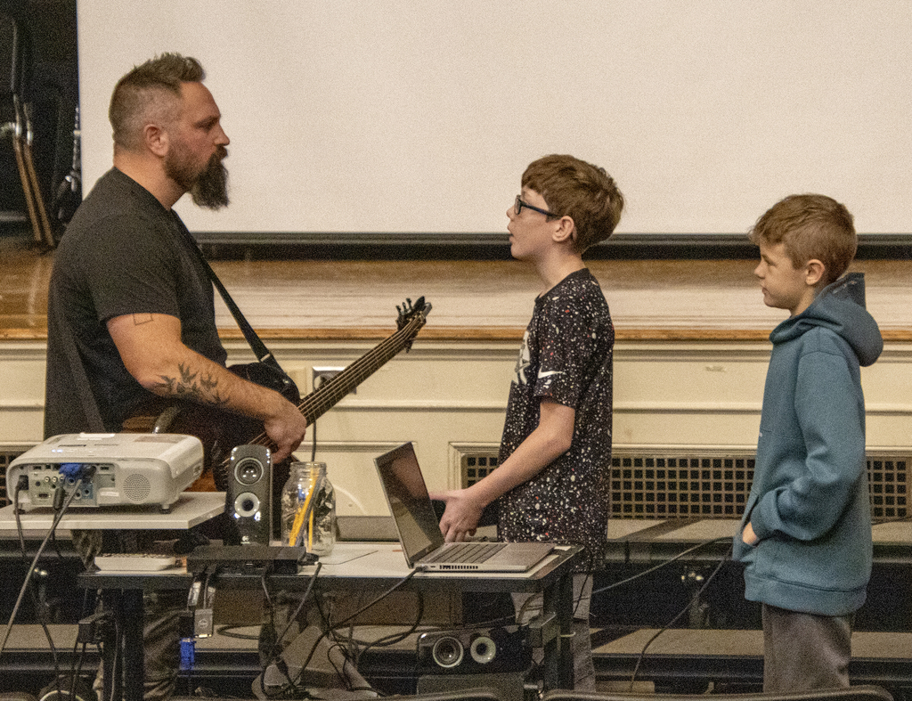 singer speaks to a student