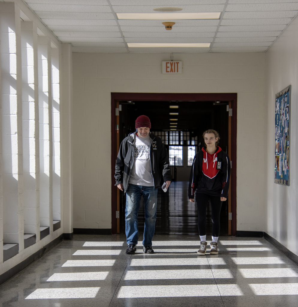 Cadence and coach in hallway