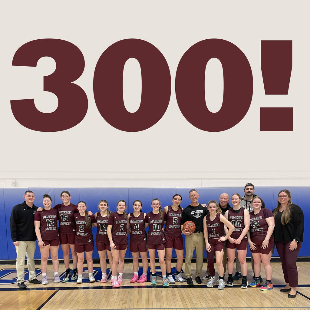 300! above picture of girls basketball team and coaches