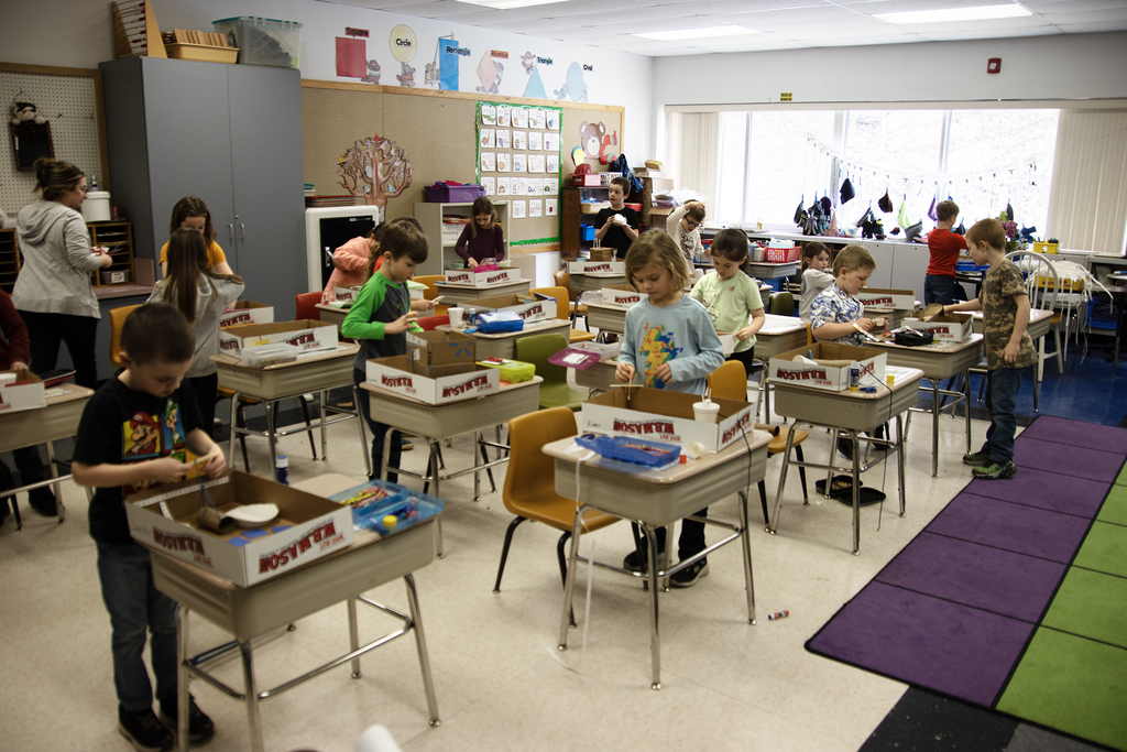 classroom of students working on a craft project