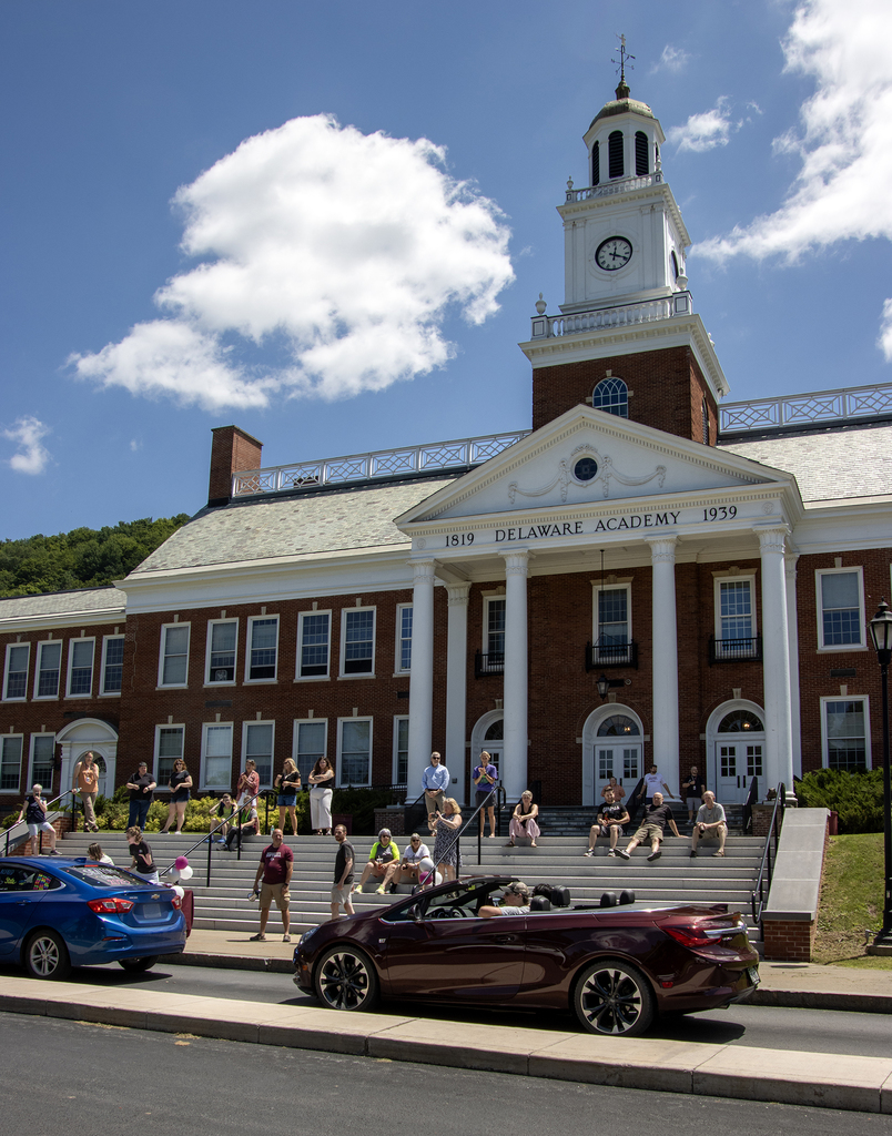 cars line up in front of school