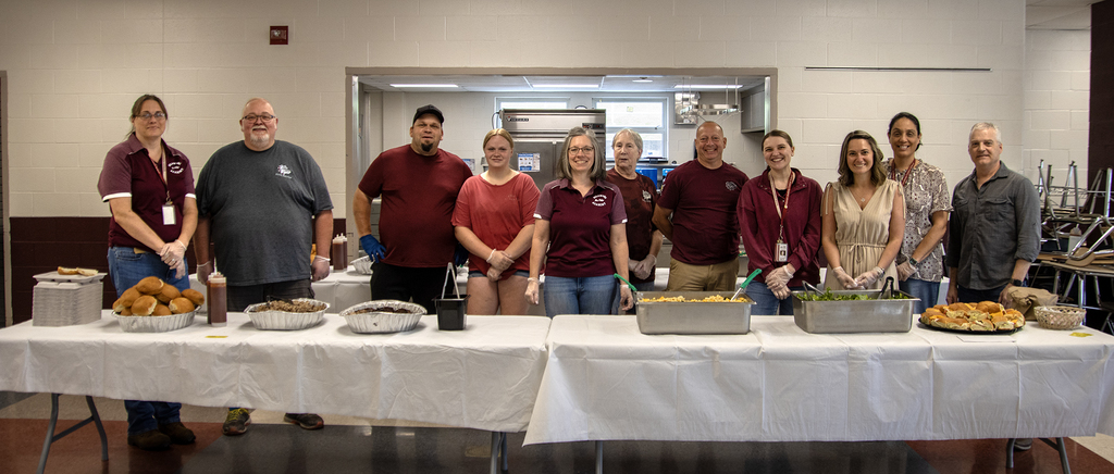staff stand ready to serve lunch