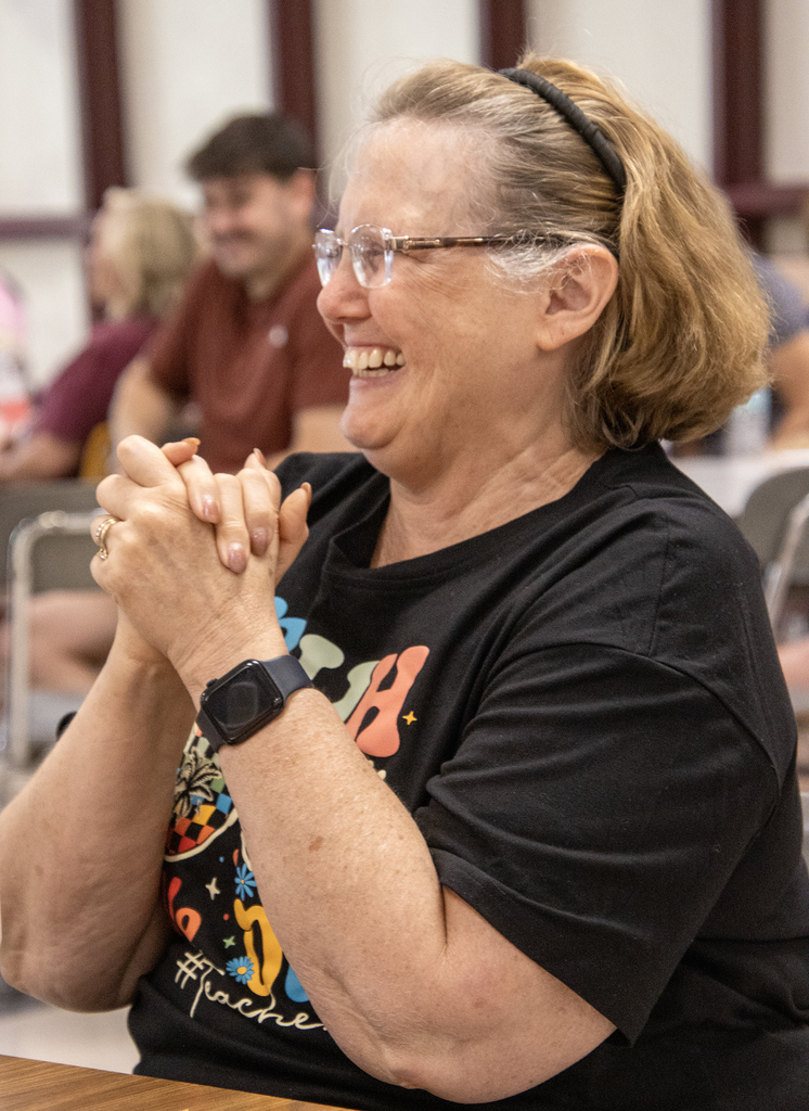 Mrs. Whittaker smiles