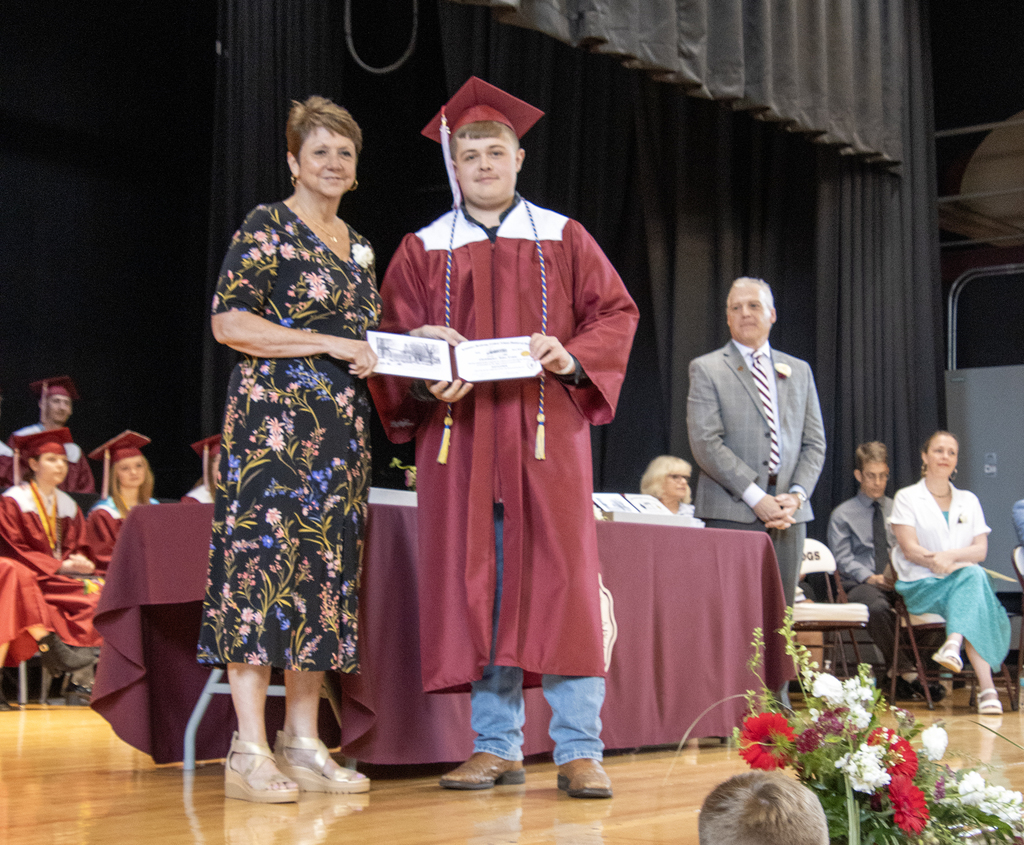 Big Chris gets his diploma from the Board of Education President