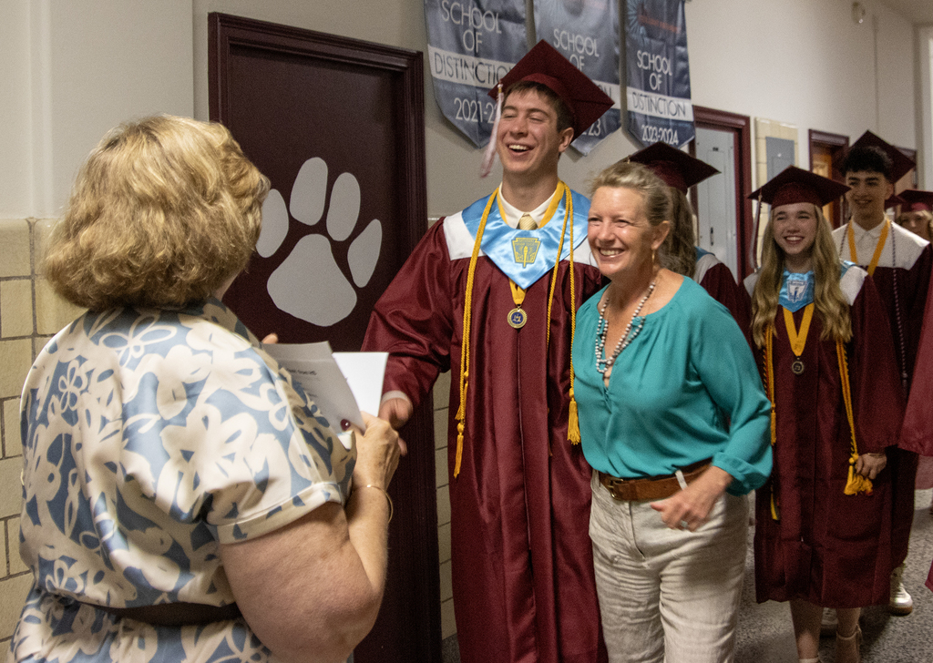 Rocco and his mom laugh with Mrs. Whittaker