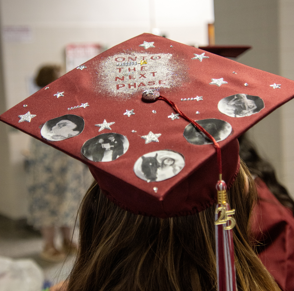 graduation cap with "Onto the next phase"