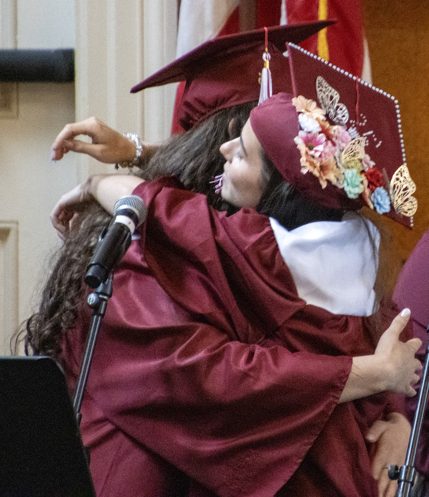 senior singers hug after finishing song