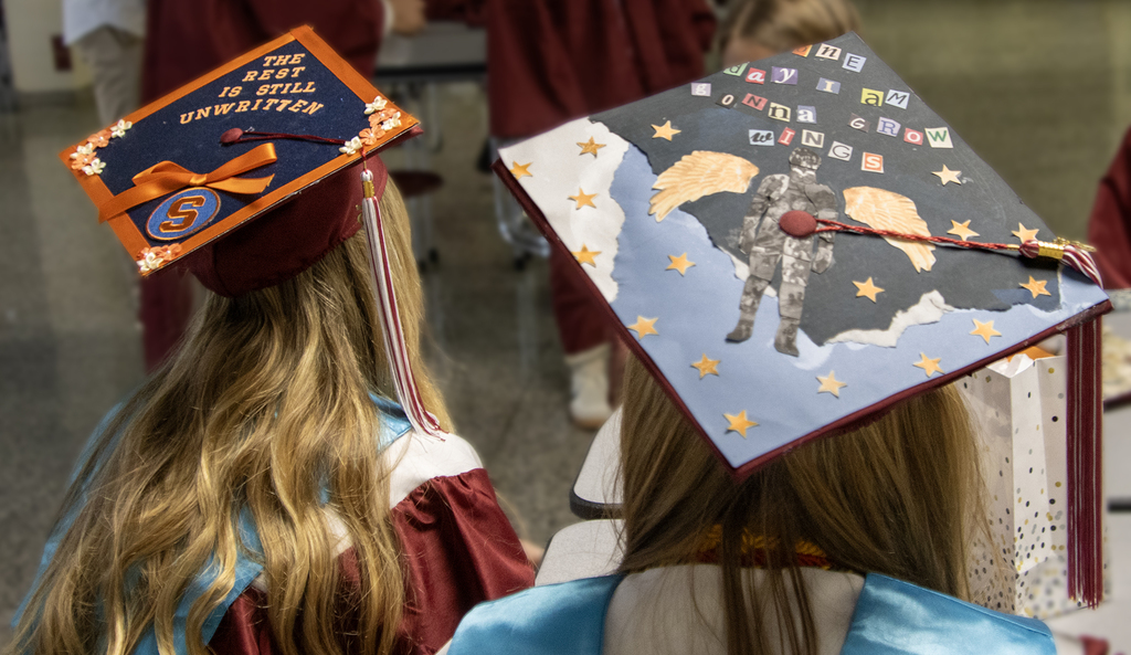 two decorated graduation caps