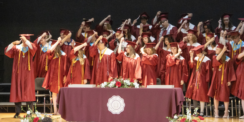 graduates move their tassles