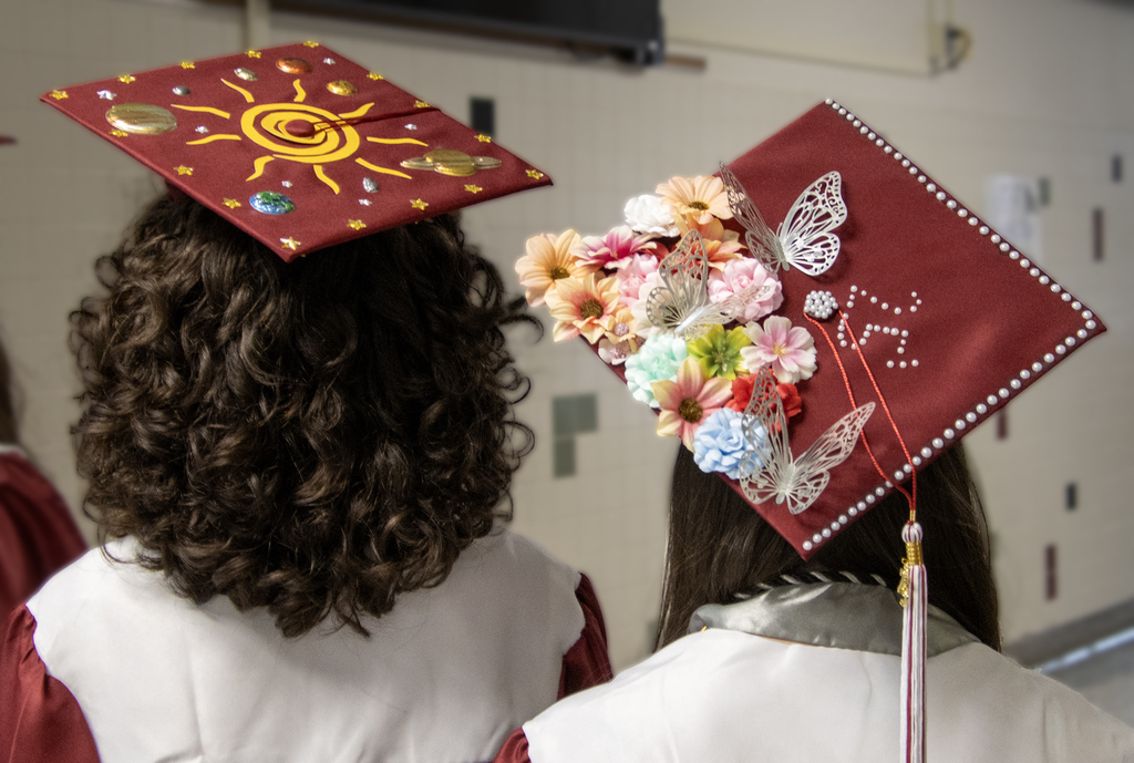 two decorated graduation caps