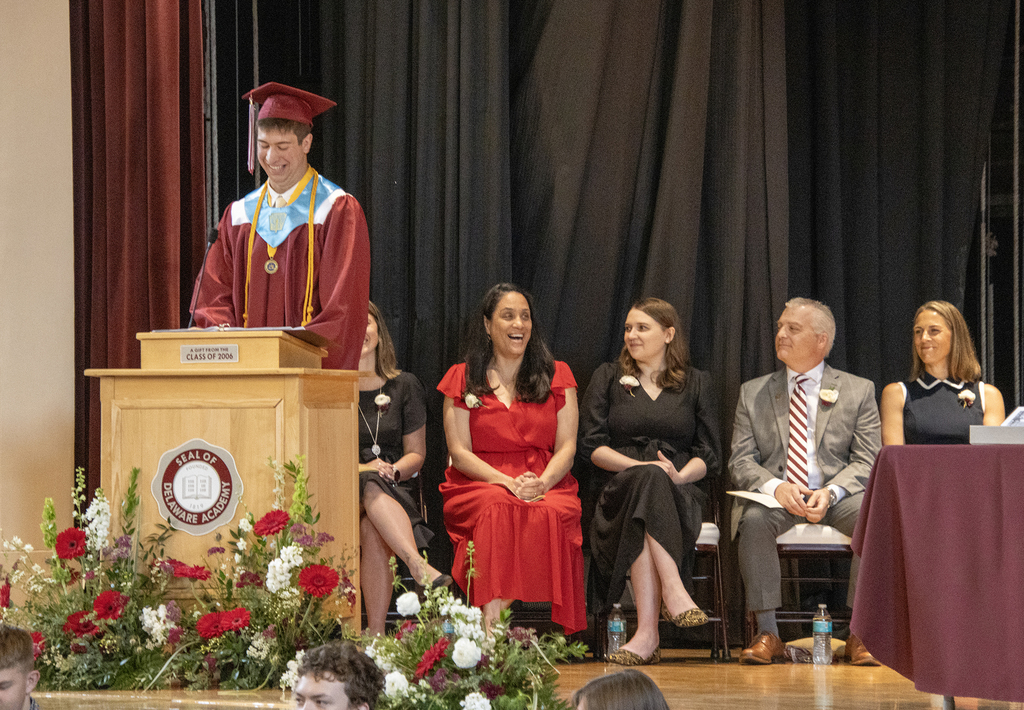 valedictorian laughs as he addresses audience
