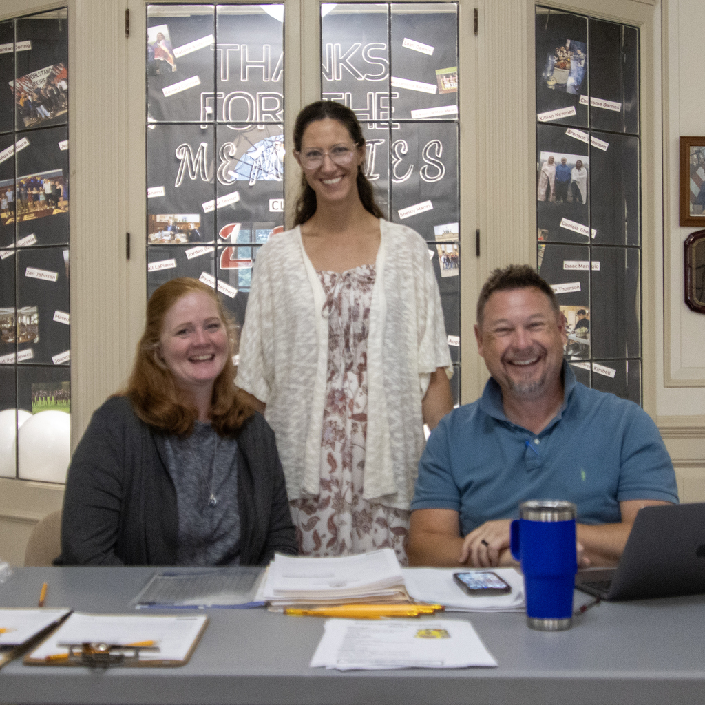 Mrs. Coleman, Ms. Dutcher and Mr. Albright pose in the HS lobby