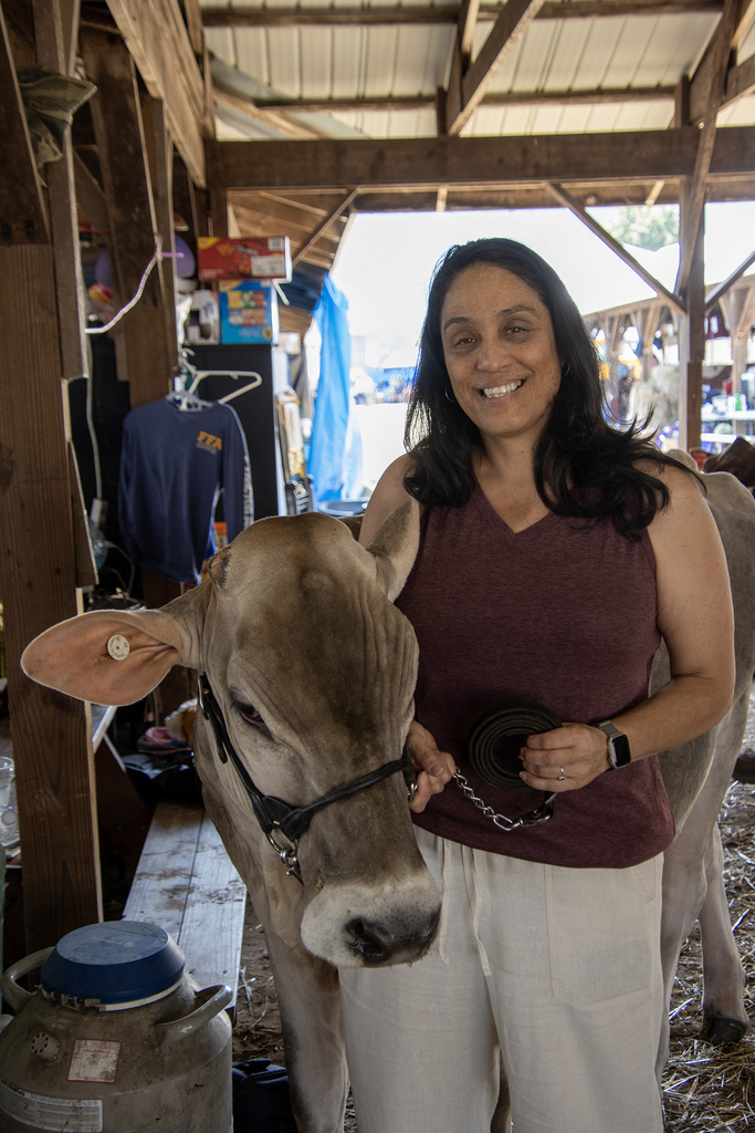 Ms. Liddle poses with a cow