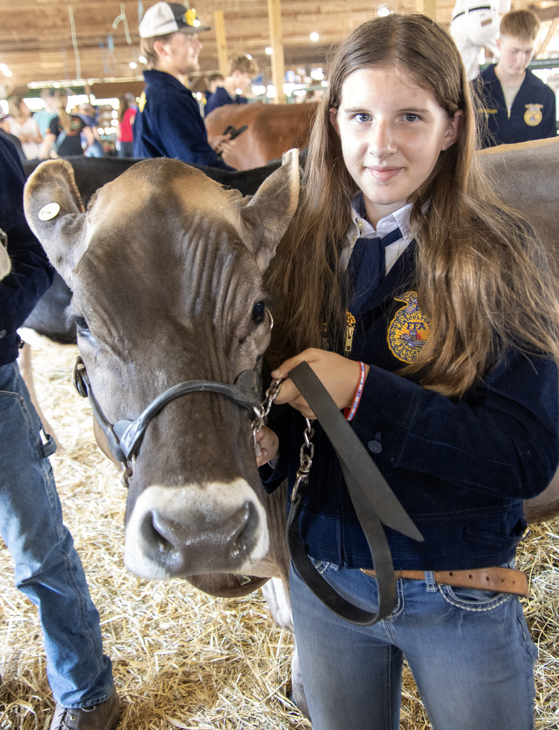 Emily Blackman poses with a cow