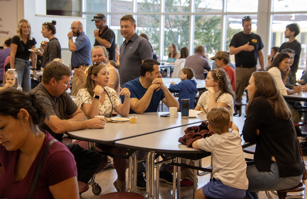 parents talk in the cafeteria