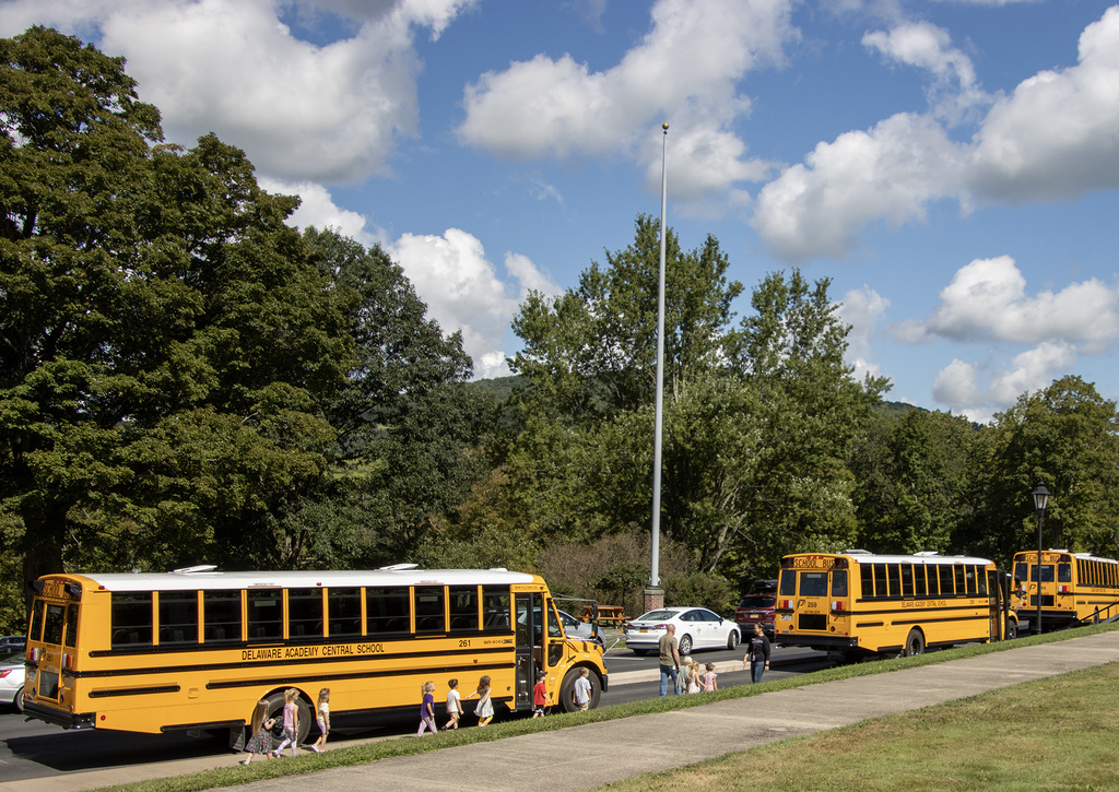 students head off for their first bus ride