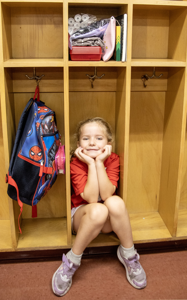 a student sits in a cubby