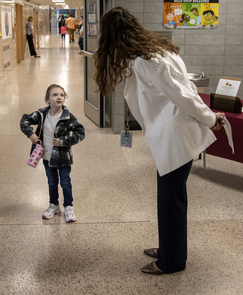Ms. Dutcher talks with a student