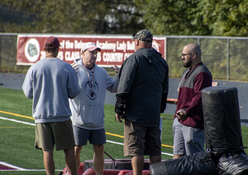 4 coaches talking
