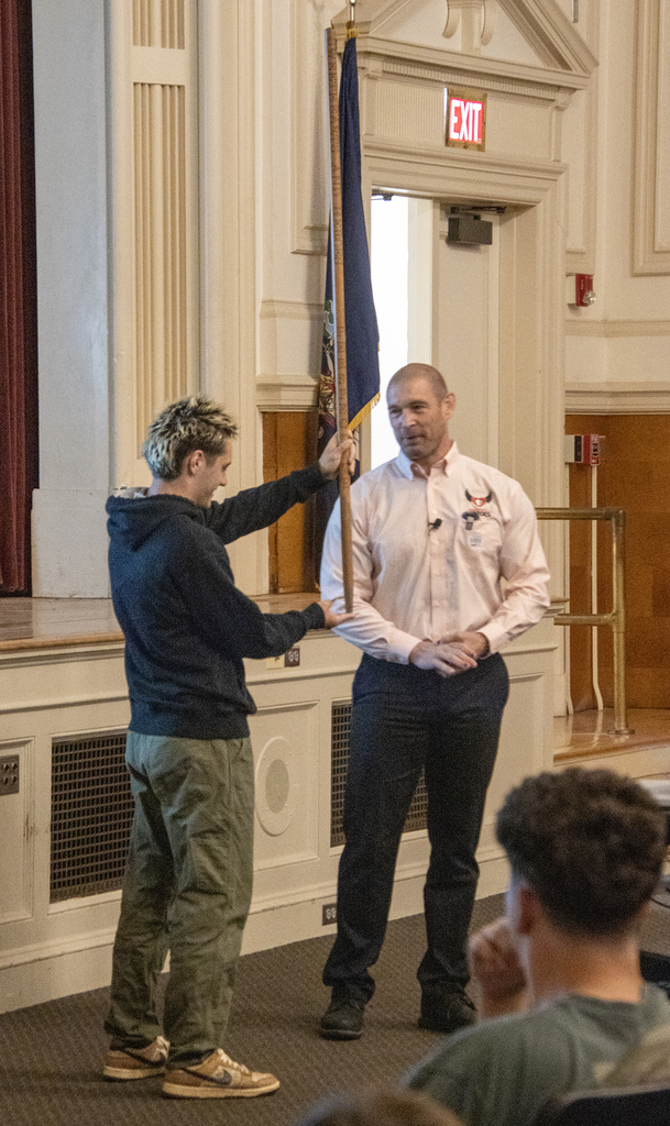 Pat Murphy with a student balancing a pole