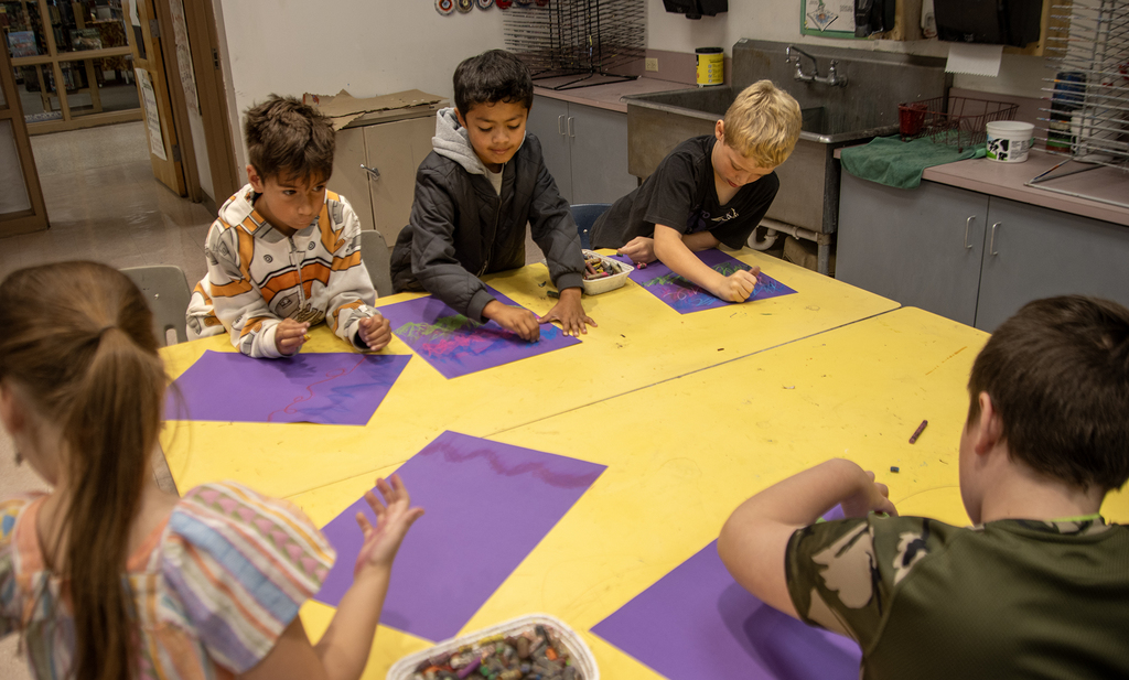 5 students working on art