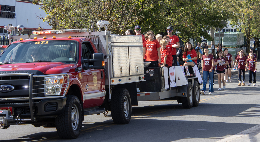 team on a fire truck in parade
