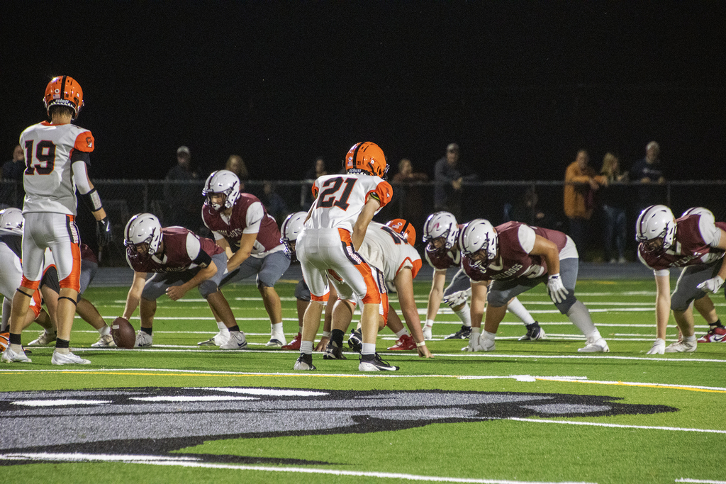 quarterback about to receive ball from center