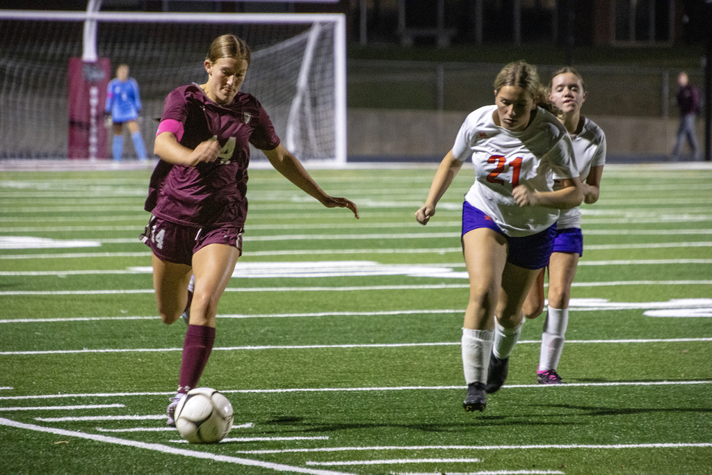 girls varsity soccer in action on the field