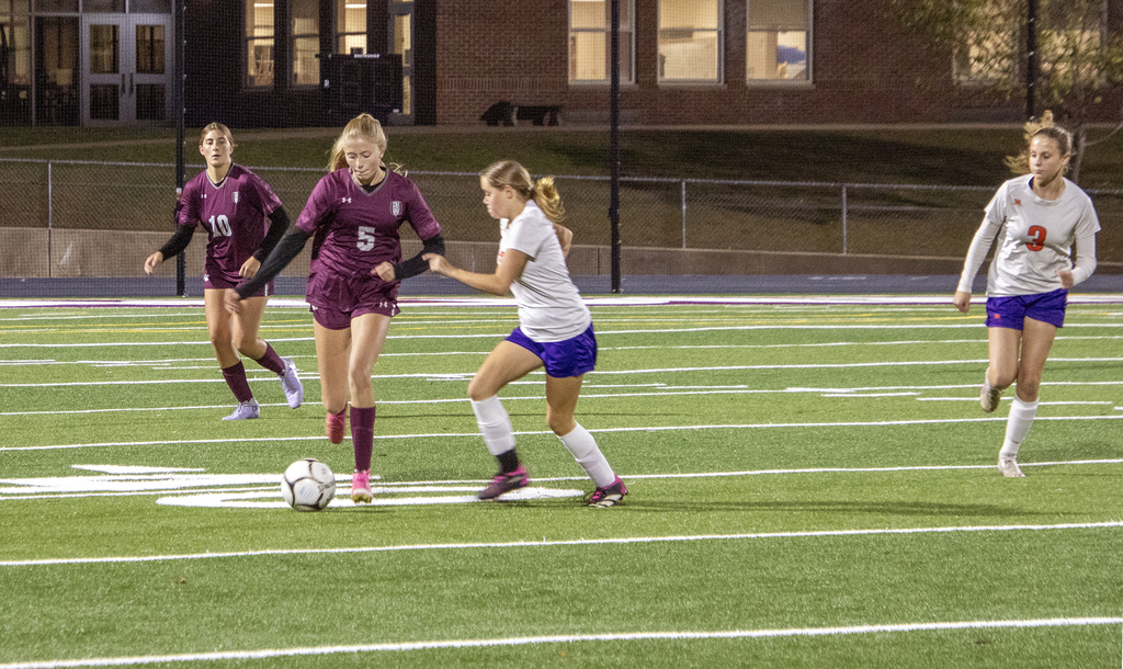 girls varsity soccer in action on the field