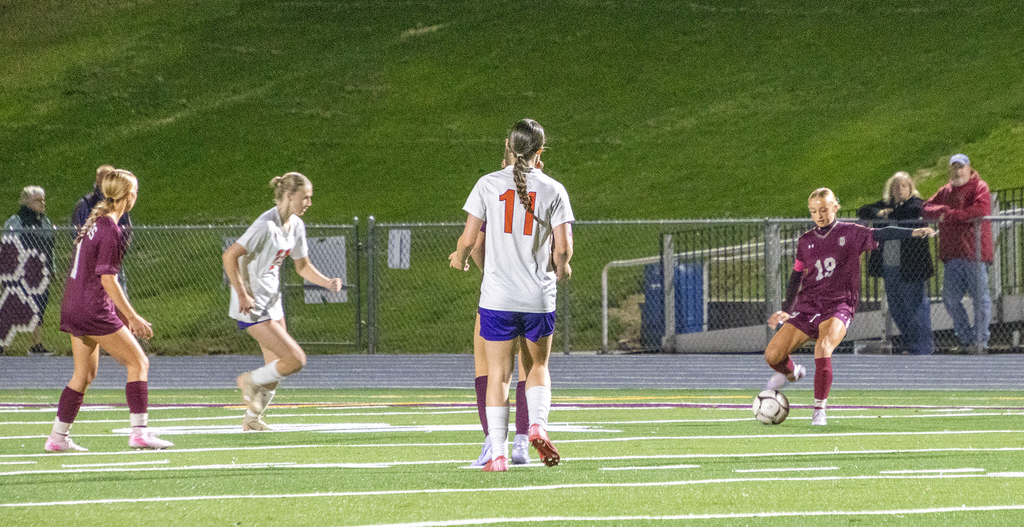 girls varsity soccer in action on the field