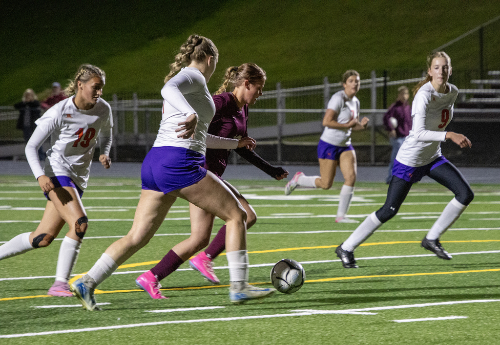 girls varsity soccer in action on the field