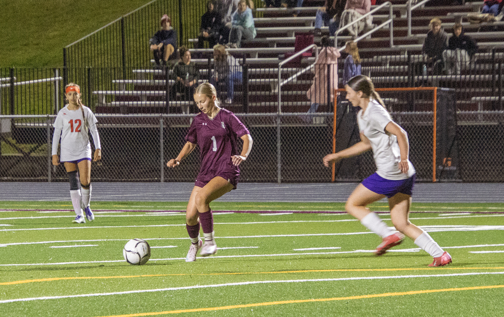girls varsity soccer in action on the field