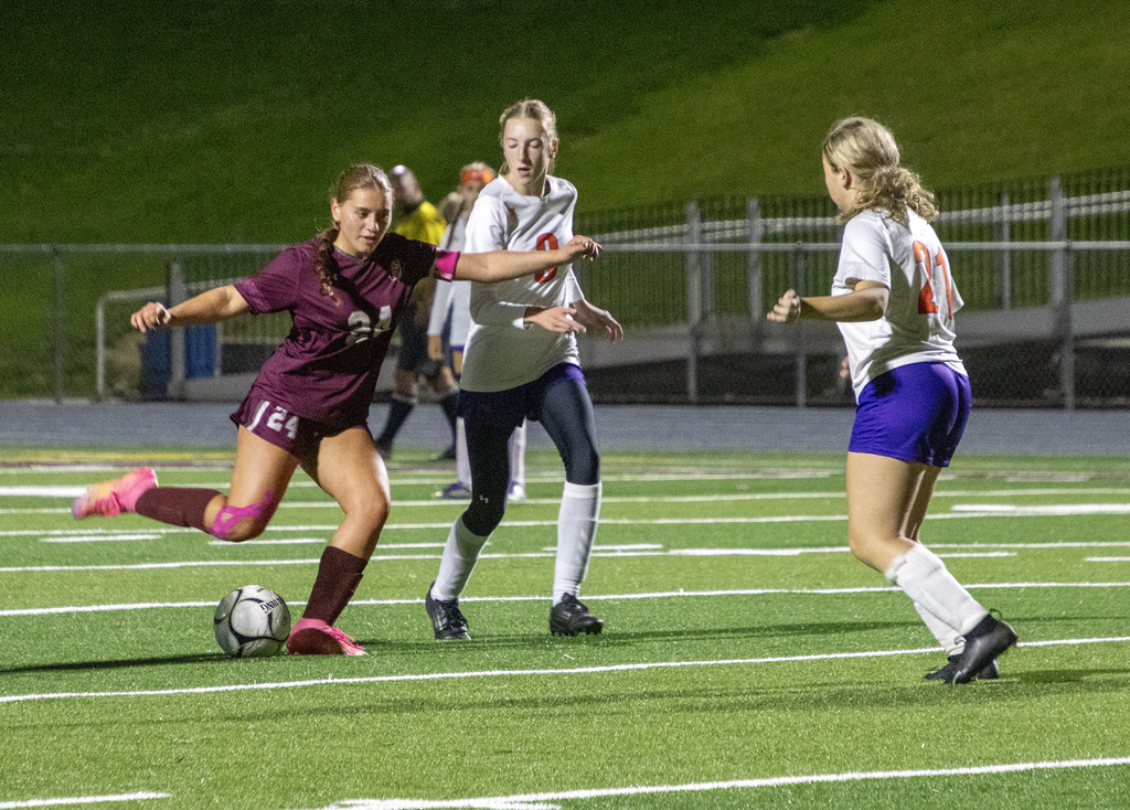 girls varsity soccer in action on the field