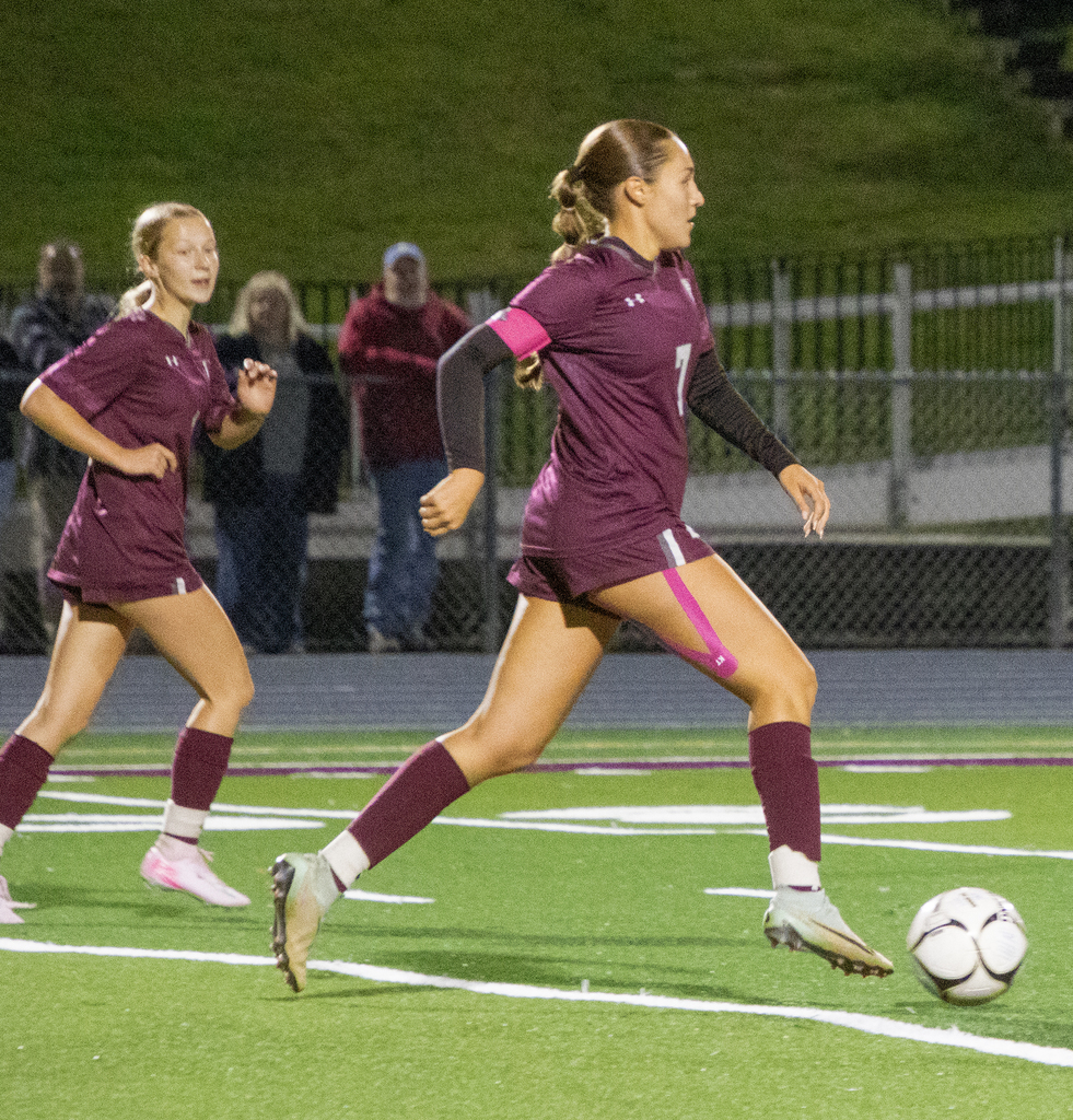 girls varsity soccer in action on the field