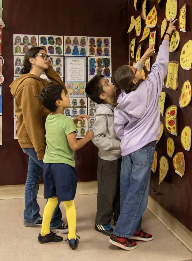 students look at work