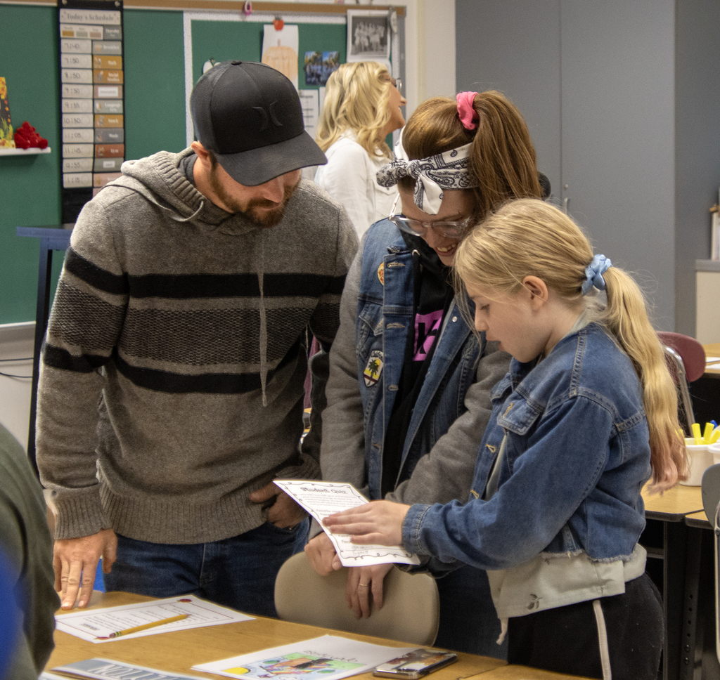 family looking at work