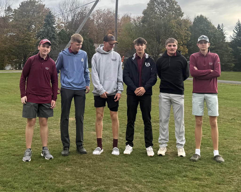 6 golfers posing in a row
