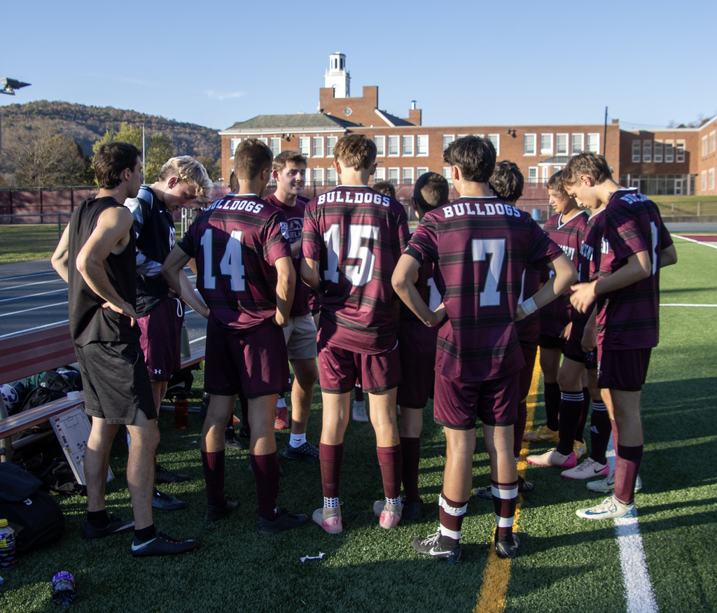 soccer players huddle