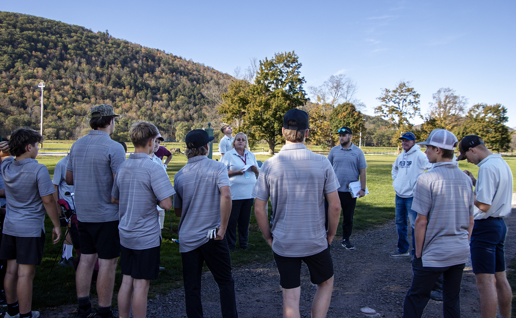 Coach Burgin speaks to the players before the match.