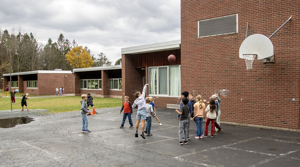 students shoot baskets