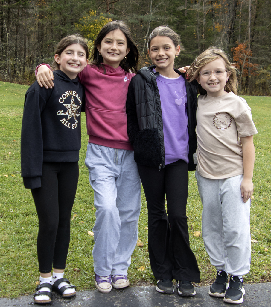 4 elementary girls pose together