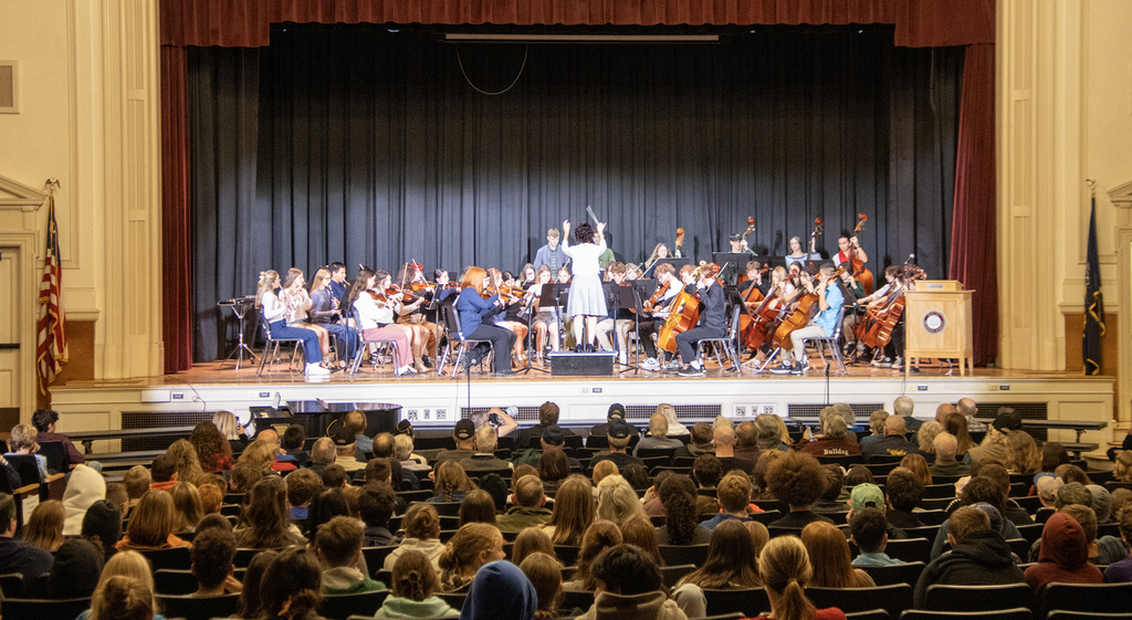 senior orchestra plays on stage