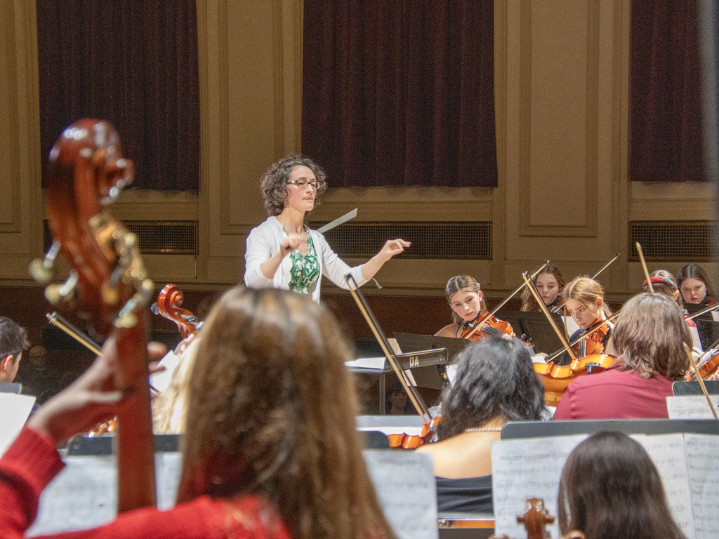 orchestra conductor conducting