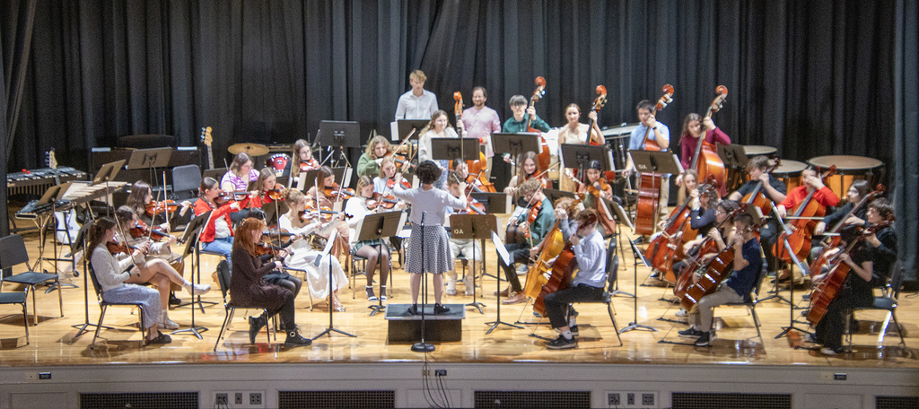 senior orchestra on stage, about to play
