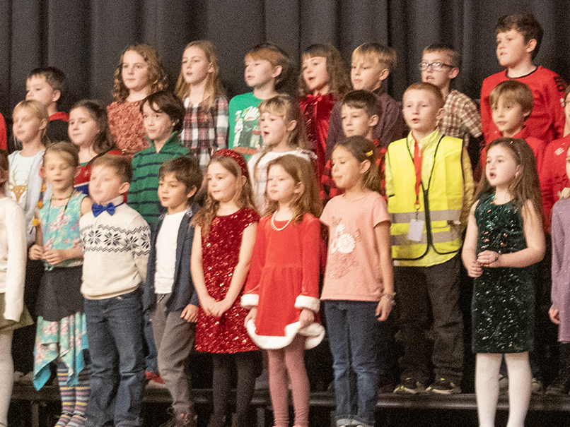 students sing on the risers