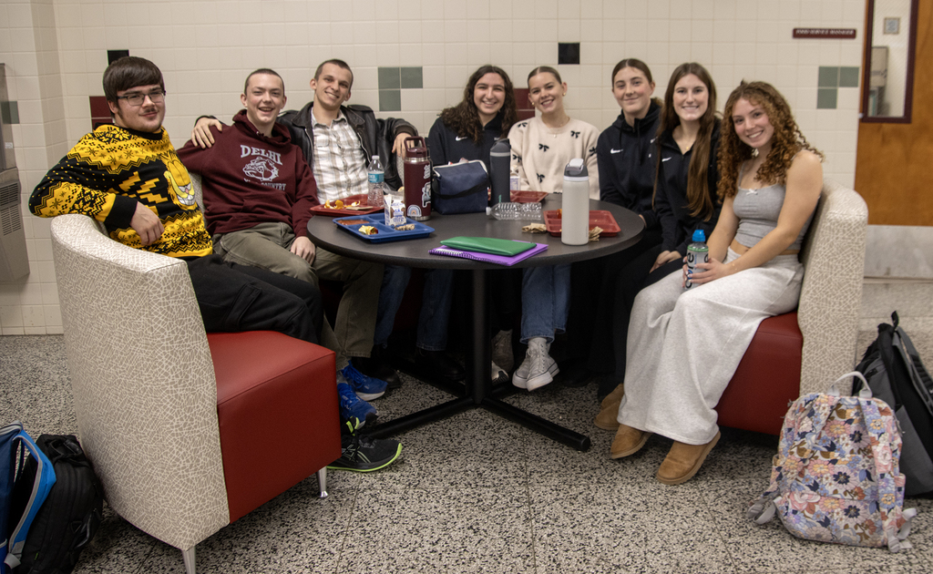 8 students in a round dining booth